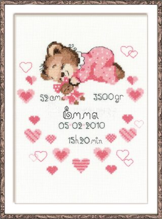 Cross-stitch birth announcement showing a sleeping brown teddy bear in pink pajamas, surrounded by pink hearts and customizable birth details.