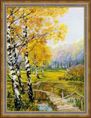 Cross-stitched autumn landscape of birch trees with golden leaves beside a rustic wooden bridge over a small stream.