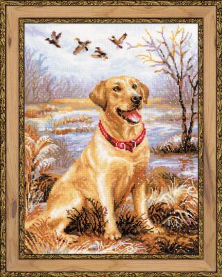 Cross-stitch embroidery of a happy golden Labrador Retriever sitting in a marshland with flying ducks and bare trees in the background. Design from RIOLIS kit 1399 Labrador.