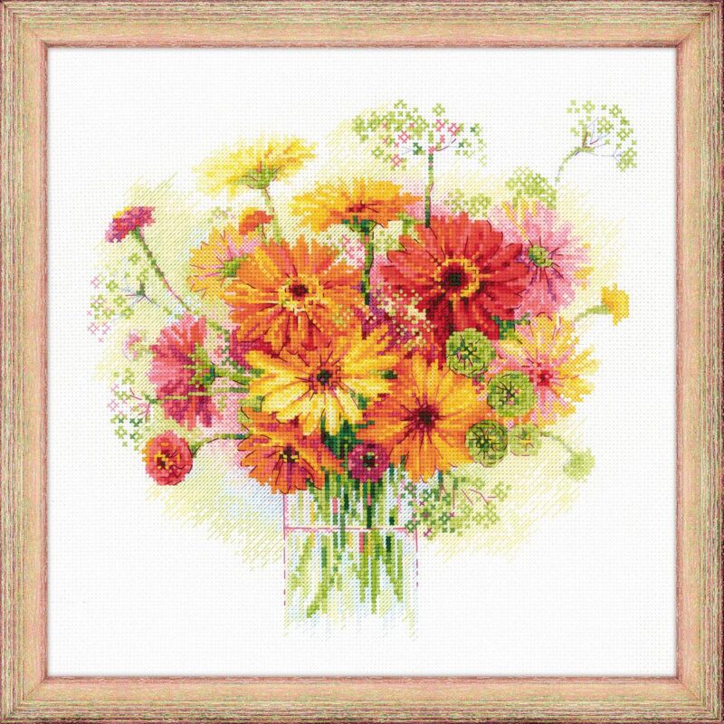 A cross-stitch artwork of a vibrant bouquet of orange, yellow, and pink gerberas in a glass vase, stitched on white fabric in a watercolor style.