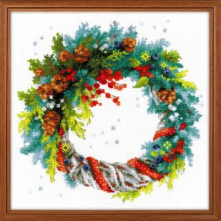 Cross-stitched wreath featuring blue spruce, pinecones, berries, and festive ribbon on white Aida cloth.