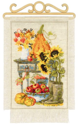 Cross stitch design of a cozy autumn still life with pumpkins, apples, sunflowers, boots, and fall foliage on a rustic table.