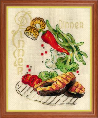 Cross stitch design of a dinner plate with grilled fish steaks, tomatoes, greens, corn, chili pepper, and herbs.