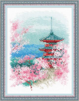 A red Japanese pagoda surrounded by blooming pink cherry blossoms with a soft mountain and water background.