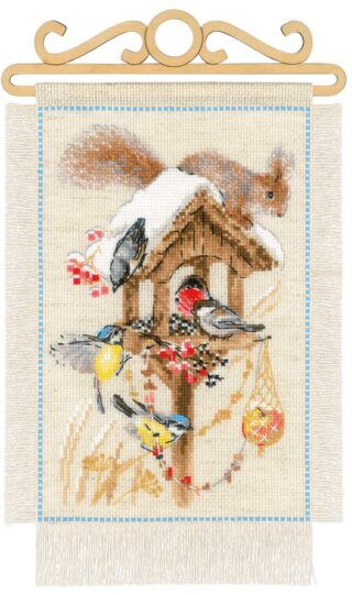 Cross-stitch scene of birds and a squirrel gathered at a snow-covered bird feeder surrounded by berries and winter foliage.