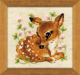 A cross-stitched fawn curled up among pink clover flowers and green leaves on beige Aida fabric.