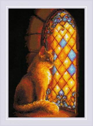 A golden-brown cat sits beside a glowing stained glass window, bathed in warm light in this dramatic cross stitch design.