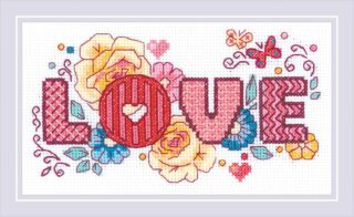 A colorful cross stitch design spelling out "LOVE" in bold pink letters, surrounded by flowers, hearts, butterflies, and decorative elements.