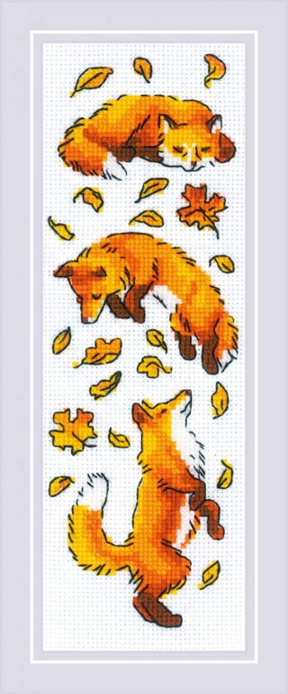 Three playful red foxes tumble and leap among swirling autumn leaves in this vertical cross-stitch design.