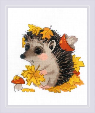 A cute hedgehog holding a yellow leaf sits among mushrooms and autumn foliage in this cozy cross-stitch design.