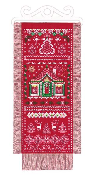 A festive cross stitch wall hanging featuring a holiday house, Christmas tree, reindeer, snowflakes, and decorative patterns stitched on red fabric.
