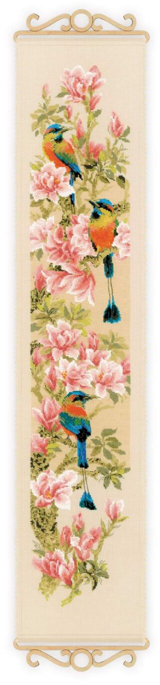 A vertical cross-stitch design featuring three colorful tropical birds perched among blooming pink magnolia flowers.