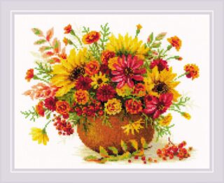 A vibrant cross-stitch design of autumn flowers in red, yellow, and orange arranged in a rustic clay vase.