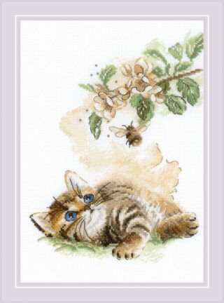 A cross-stitch of a kitten lying in grass and gazing at a flying bumblebee near a blooming branch with soft yellow and green tones.
