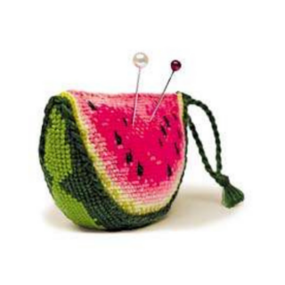 Cross-stitch design of a watermelon-shaped pincushion with pink flesh, green rind, and black seed details.
