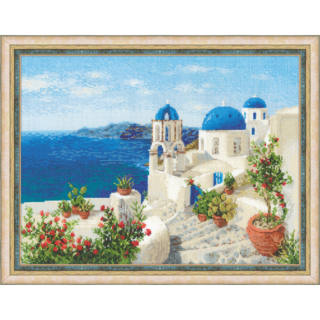 Cross stitch design of a sunny coastal scene in Santorini with white buildings, blue domes, and flowering plants by the sea.