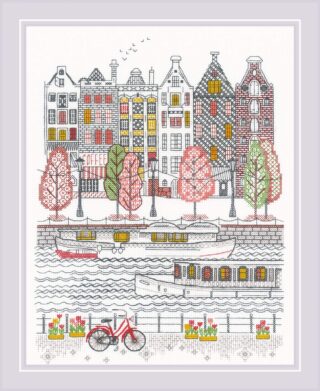 A cross-stitch design of colorful canal houses, boats, trees, and a red bicycle, depicting a charming European city scene by the water.