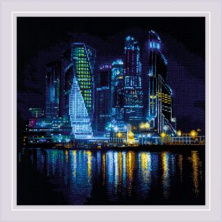 A dazzling cross stitch design of a modern city skyline at night with glowing skyscrapers and colorful reflections shimmering on the water.