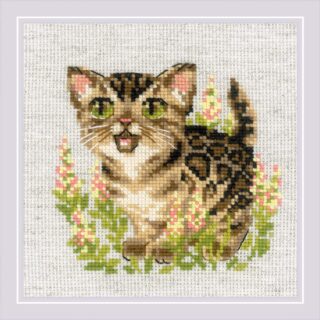 Cross-stitch design of a Bengal kitten with green eyes standing among pink and green flowers.