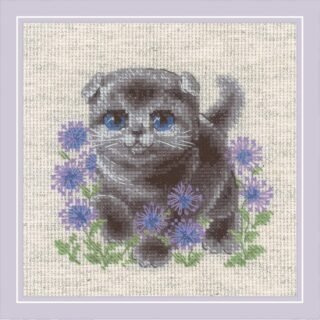 A cross-stitch design of a gray lop-eared kitten with blue eyes, surrounded by purple wildflowers on a neutral fabric background.