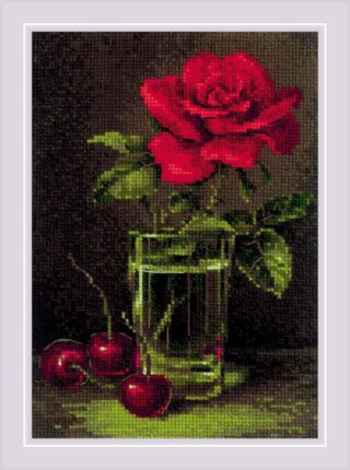 A deep red rose in a glass vase with cherries beside it, stitched on a dark background.