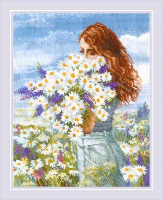 A cross-stitch design of a red-haired woman standing in a sunny meadow, holding a large bouquet of daisies and purple wildflowers.