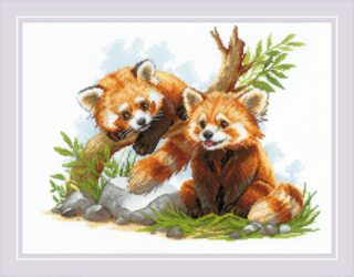 A cross-stitch design of two playful red panda cubs, one sitting on the grass and the other climbing a tree branch, surrounded by greenery and rocks.