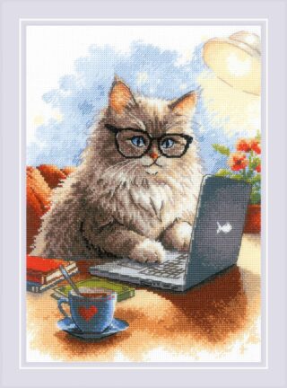 A fluffy cat wearing glasses types on a laptop beside a cup of tea and stacked books in this whimsical cross-stitch design.