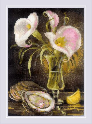 Elegant still life cross-stitch featuring soft pink and white calla lilies in a glass vase with an oyster shell and lemon slice.