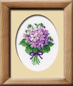 Cross-stitch design of a small bouquet of purple violets tied with a dark purple ribbon.