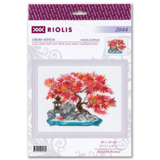 A vibrant cross stitch design of a bonsai tree with bright red and orange autumn leaves, set on a rocky base with a small lantern decoration.