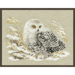Cross-stitch embroidery of a white owl with golden eyes, resting among snow-covered grasses. The owl’s feathers are detailed in white, grey, and black tones. Design from RIOLIS kit 1241 White Owl.