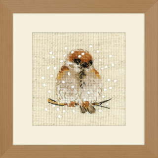 Cross stitch design of a small brown sparrow sitting on a branch with snowflakes falling around it.