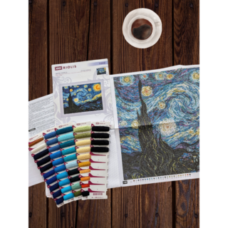 Cross-stitch embroidery of Vincent van Gogh’s Starry Night painting, featuring swirling blue skies, bright yellow stars, and a dark village below. Framed in an ornate gold frame. Design from RIOLIS kit 1088.