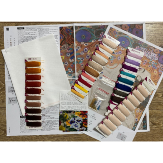 A cross-stitch design inspired by Gustav Klimt’s painting, showing a serene mother with flowing red hair tenderly embracing her sleeping child against a vibrant floral background.