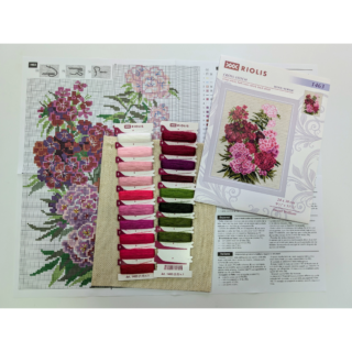 Cross stitch of bright pink, deep red, and pale pink Sweet William flowers arranged in a dense bouquet with green leaves.