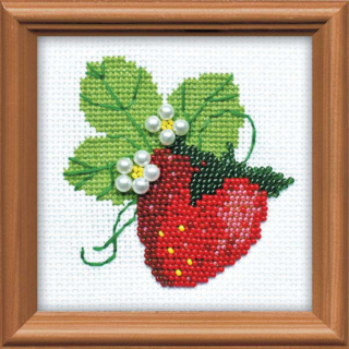 Cross stitch with beads on a bright red strawberry with green leaves and white pearl-like beaded flowers on white fabric.
