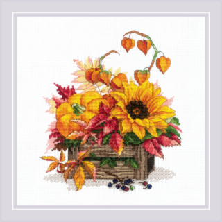A rustic wooden box overflows with pumpkins, sunflowers, fall leaves, and berries in this autumn-themed cross-stitch design.