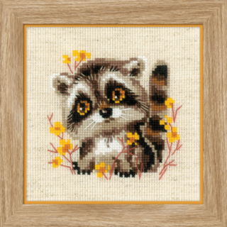 Cross-stitch of a baby raccoon with big amber eyes surrounded by yellow wildflowers on beige fabric.