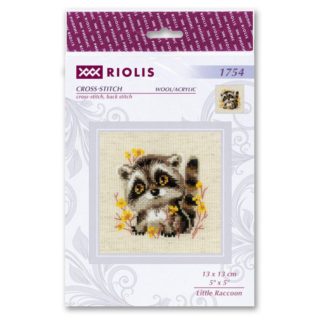 Cross-stitch of a baby raccoon with big amber eyes surrounded by yellow wildflowers on beige fabric.