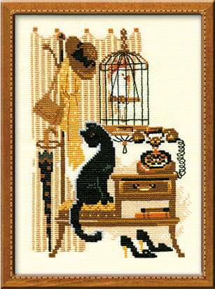 A cross-stitch design of a vintage vanity with an old-fashioned rotary telephone, a black cat sitting on the stool, a birdcage, and classic accessories like shoes and a hat.