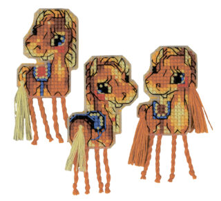 Three cross-stitched horse magnets with orange tassel legs and decorative blue saddles.