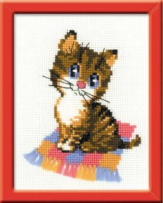 A striped kitten with blue eyes and a pink nose sits on a colorful fringed mat in this playful cross-stitch design.