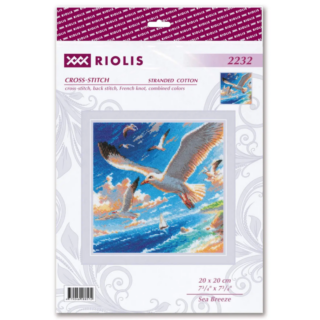 Cross-stitch design featuring seagulls soaring above a sparkling blue sea with a sailboat in the distance and waves crashing against a rocky shore.