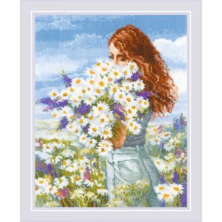 A cross-stitch design of a red-haired woman standing in a sunny meadow, holding a large bouquet of daisies and purple wildflowers.