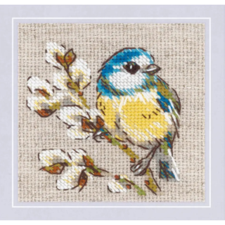 Cross-stitch design of a blue and yellow titmouse perched on a blooming branch with white flowers, stitched on natural-colored fabric.