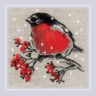 Cross-stitch design of a bullfinch perched on a snowy branch with red berries against a neutral background.