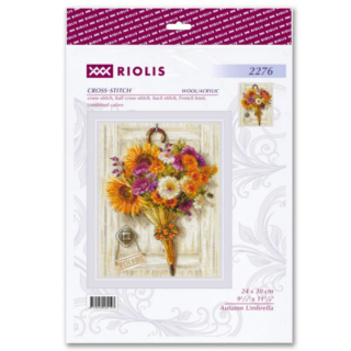 A cozy cross-stitch design of an umbrella filled with bright autumn flowers hanging on a wooden door with a welcome sign.