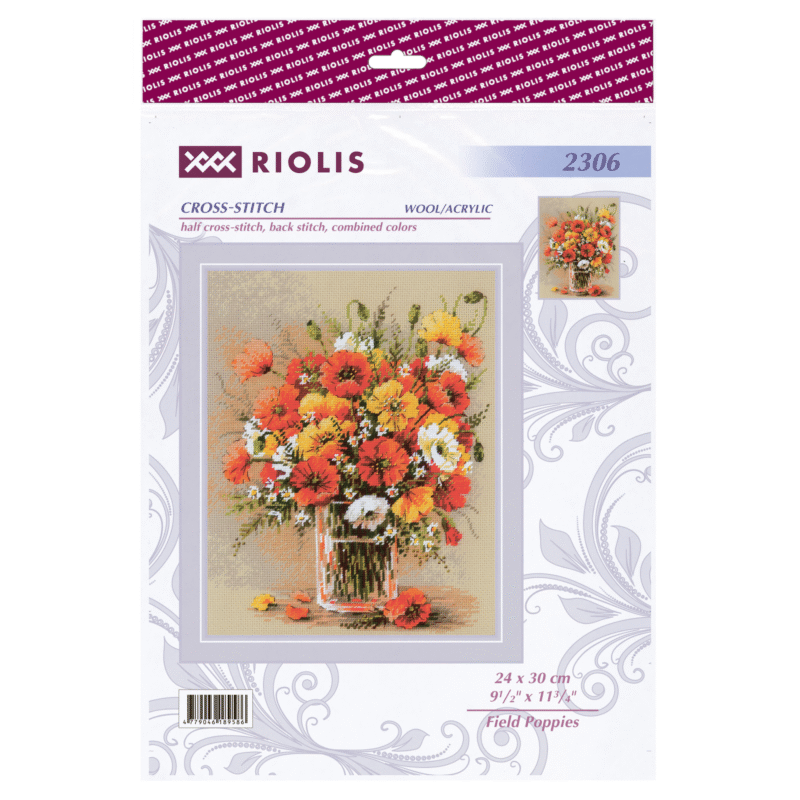 A vibrant cross-stitched bouquet of red, yellow, and white field poppies arranged in a glass vase, with scattered petals around the base.