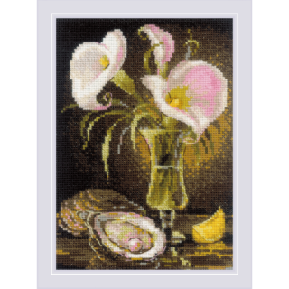 Elegant still life cross-stitch featuring soft pink and white calla lilies in a glass vase with an oyster shell and lemon slice.